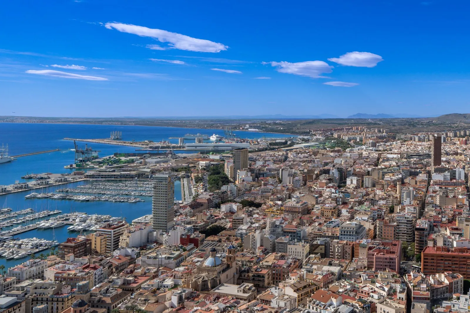 Aerial view of Alicante, Spain, showcasing the city's marina and coastal landscape.