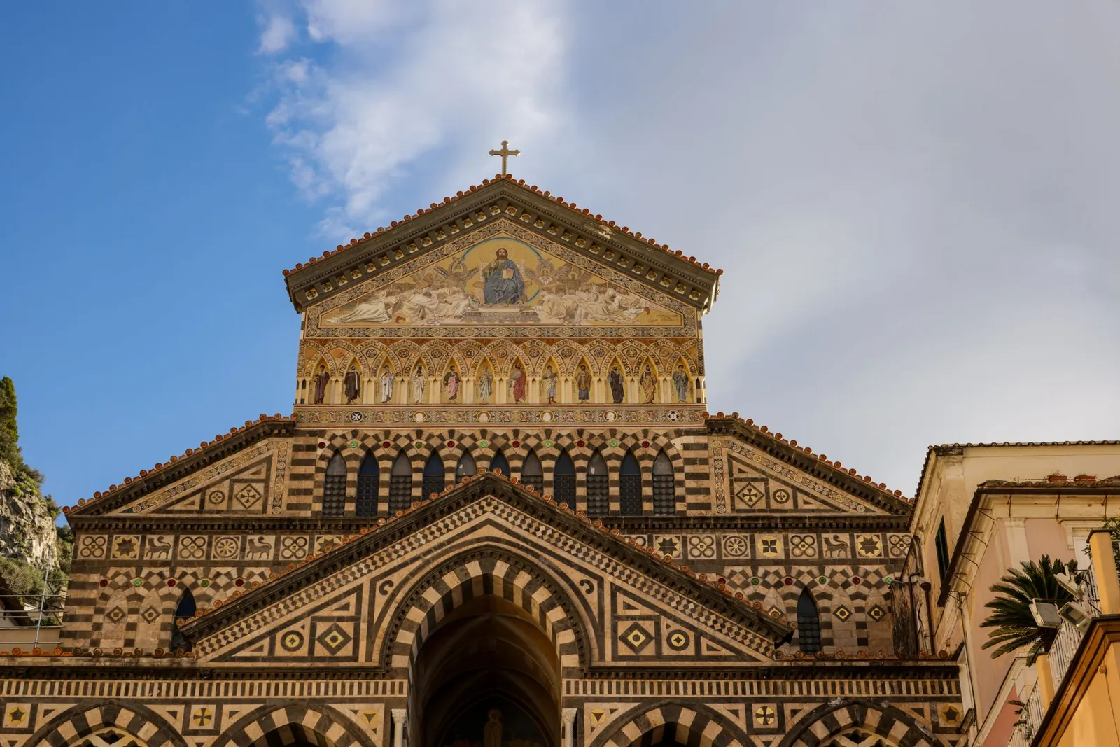 Stunning façade of Amalfi Cathedral showcasing intricate Mediterranean architecture.