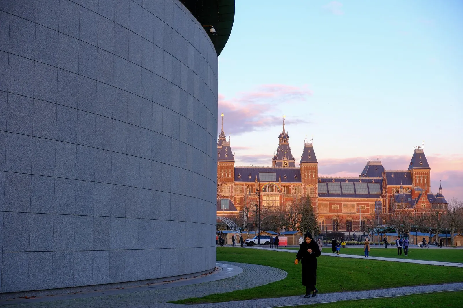 Captivating view of the Rijksmuseum and park at sunset in Amsterdam, capturing urban charm.