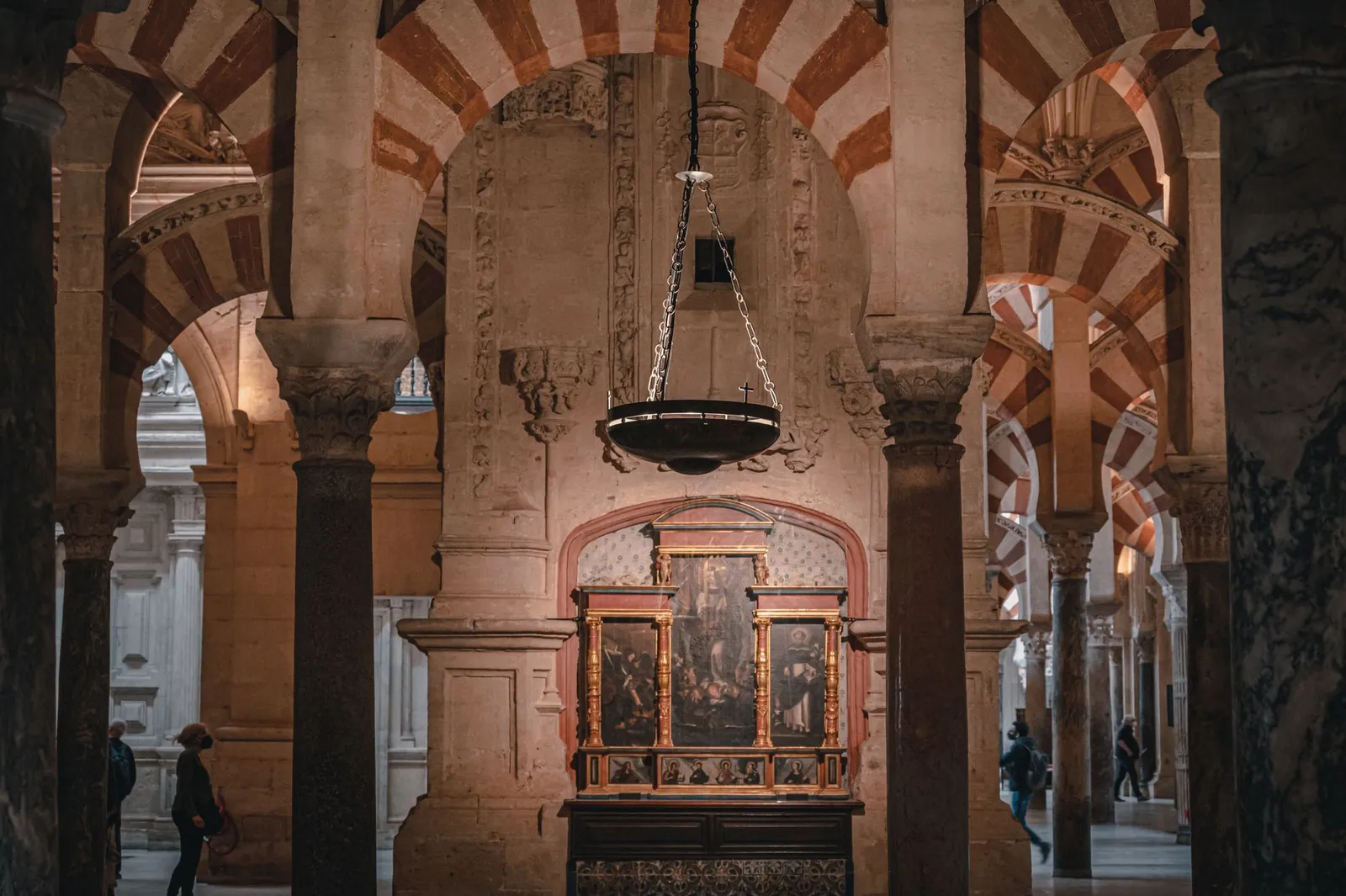 Striking arches and historical art inside the stunning Mosque-Cathedral of Córdoba.