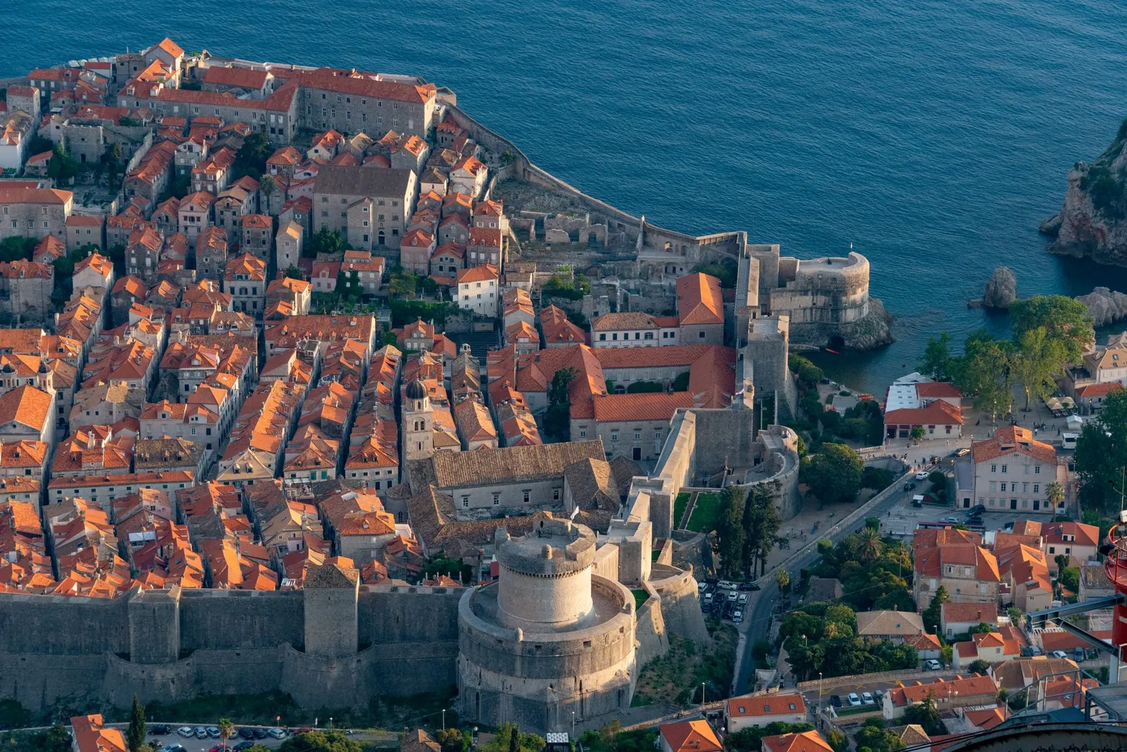Stunning aerial view of the historic Dubrovnik Old Town and its city walls by the Adriatic Sea.