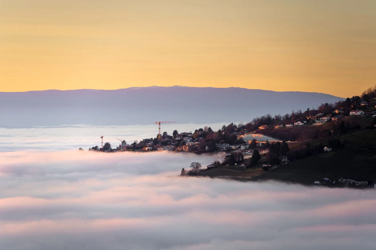 Majestic sunset over Lausanne with a sea of clouds blanketing the valley.
