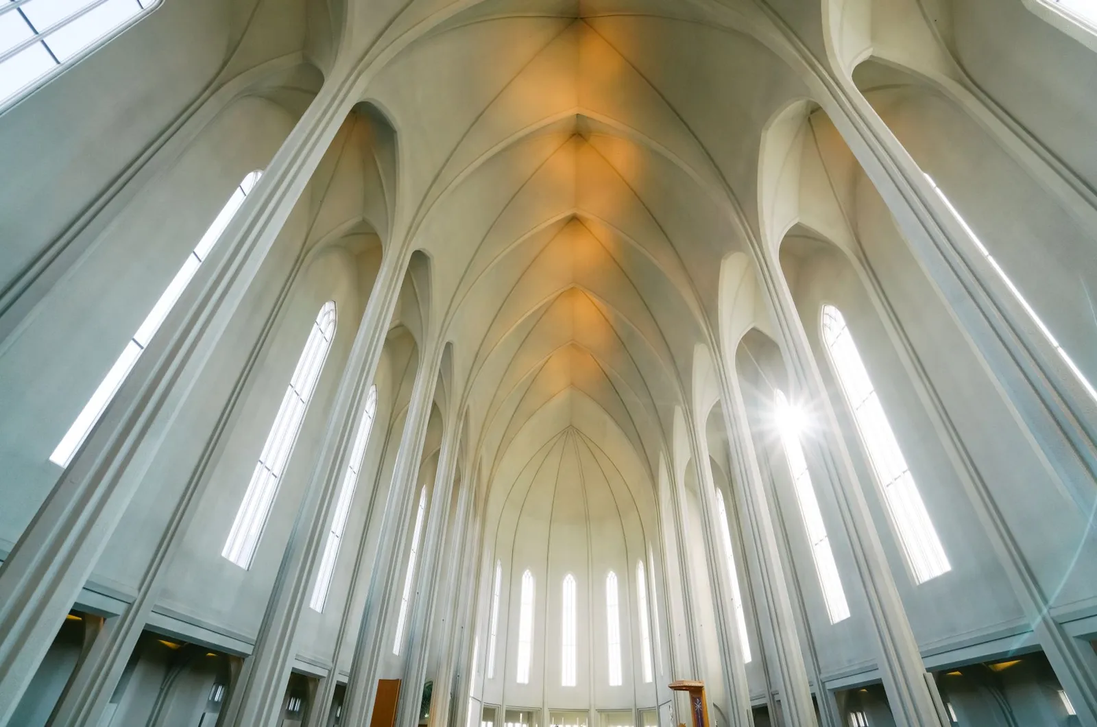 Sunlight filters through the modern cathedral's arched ceiling showcasing architectural elegance.