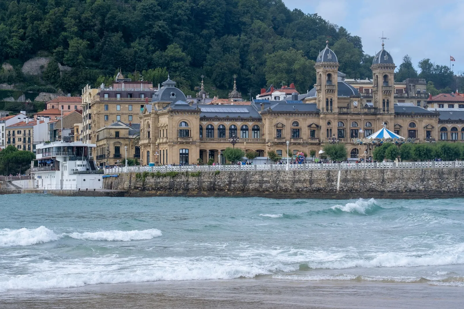 Historic building along the coast of San Sebastián, showcasing grand architecture and vibrant sea views.