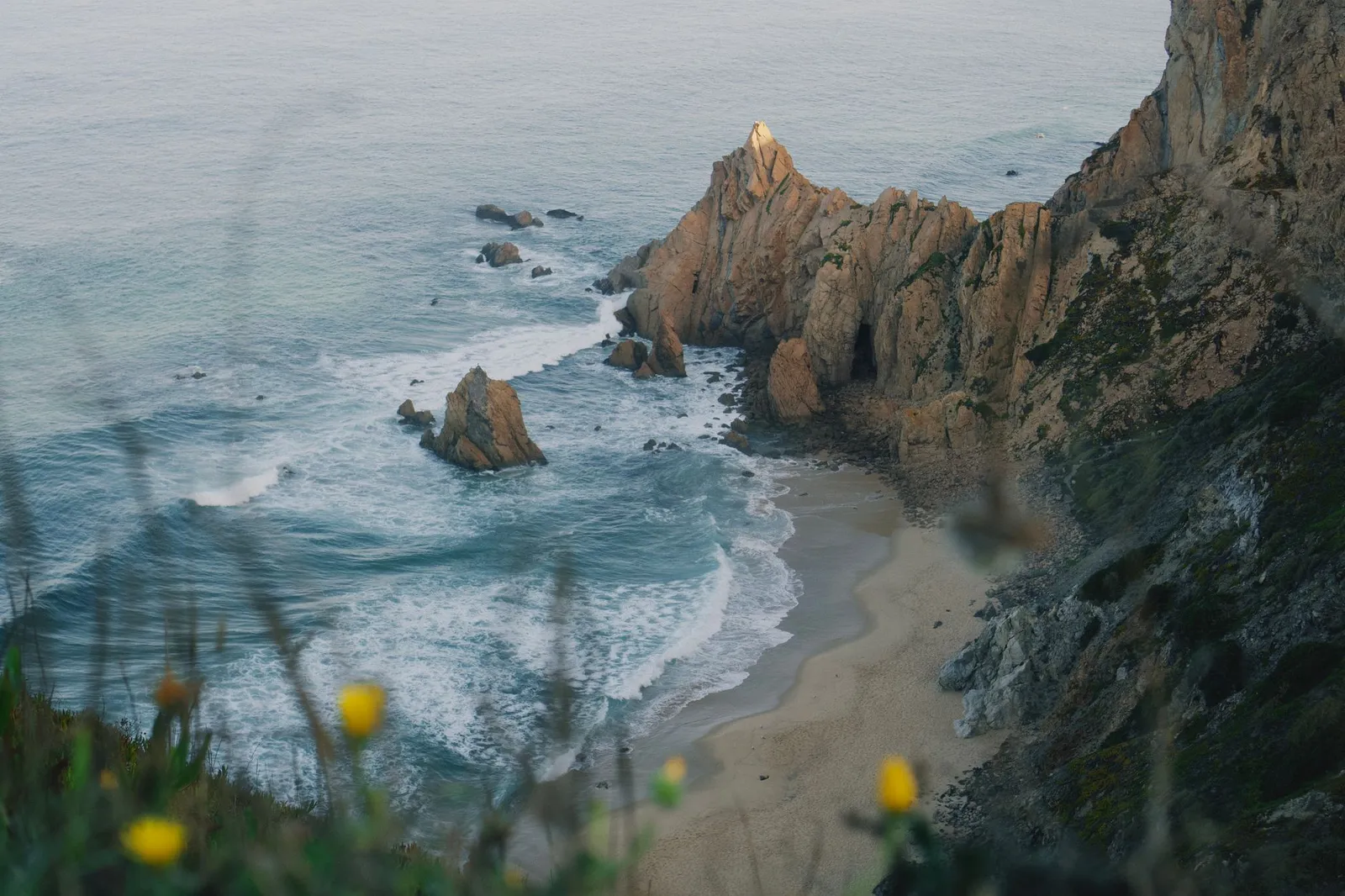 Explore the dramatic cliffs and serene beaches of Sintra, Portugal's stunning Atlantic coastline.