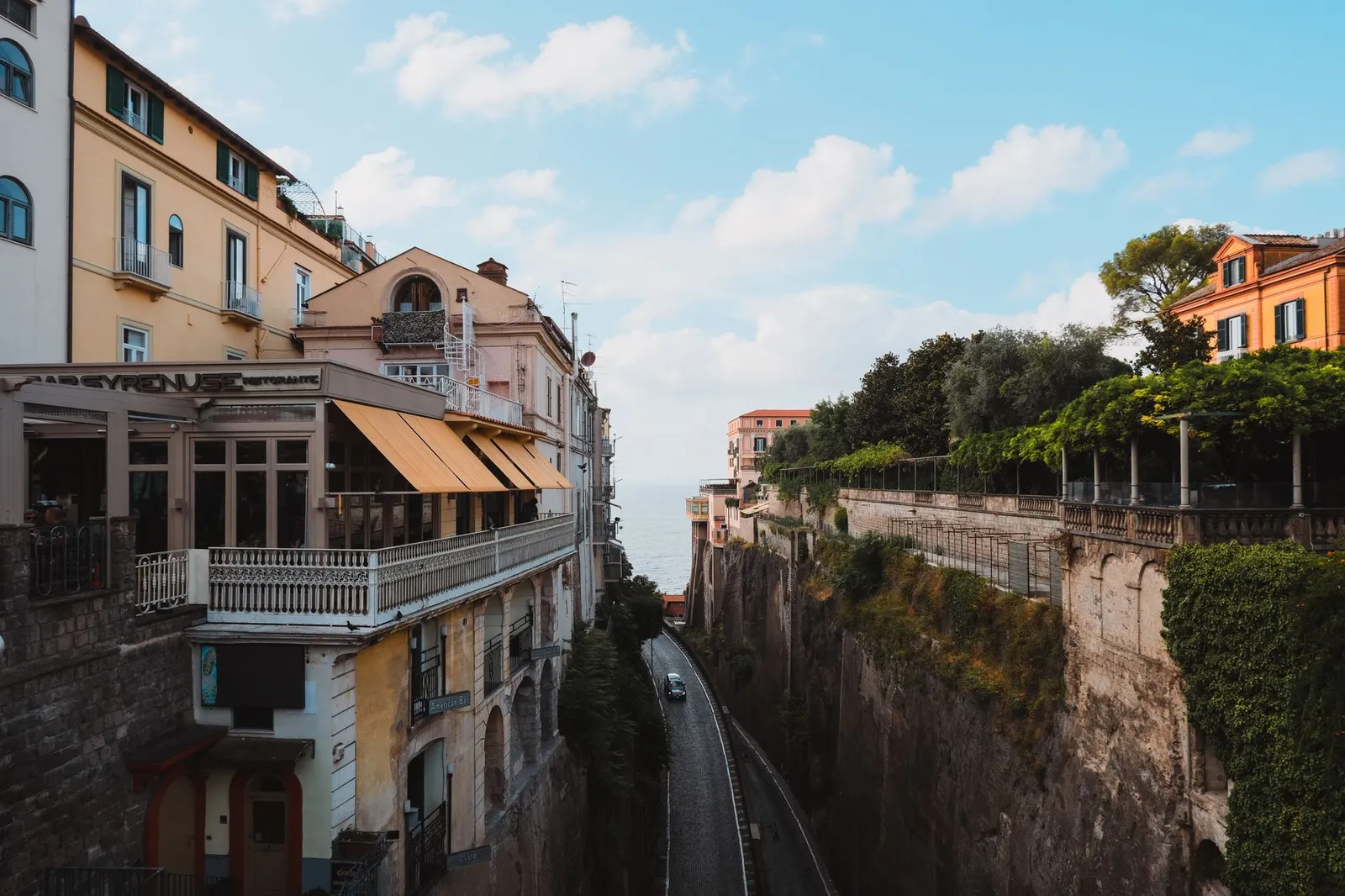 Charming view of Sorrento's streets and architecture with a glimpse of the sea in summer.
