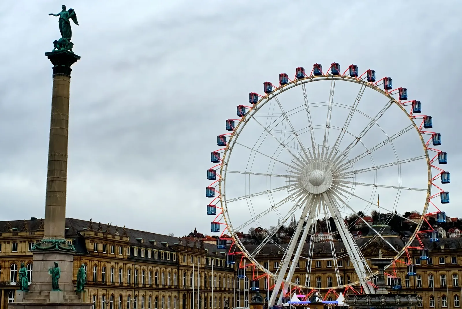 View of the Ferris wheel and column statue at Schlossplatz, Stuttgart, Germany.