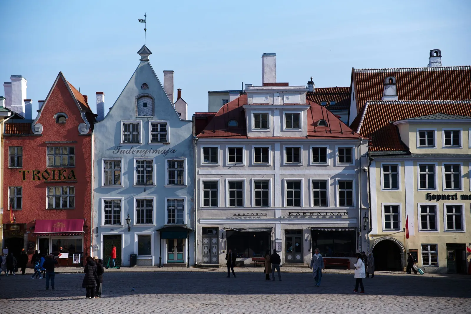 Charming historic buildings in Tallinn's Old Town square, a UNESCO World Heritage site.
