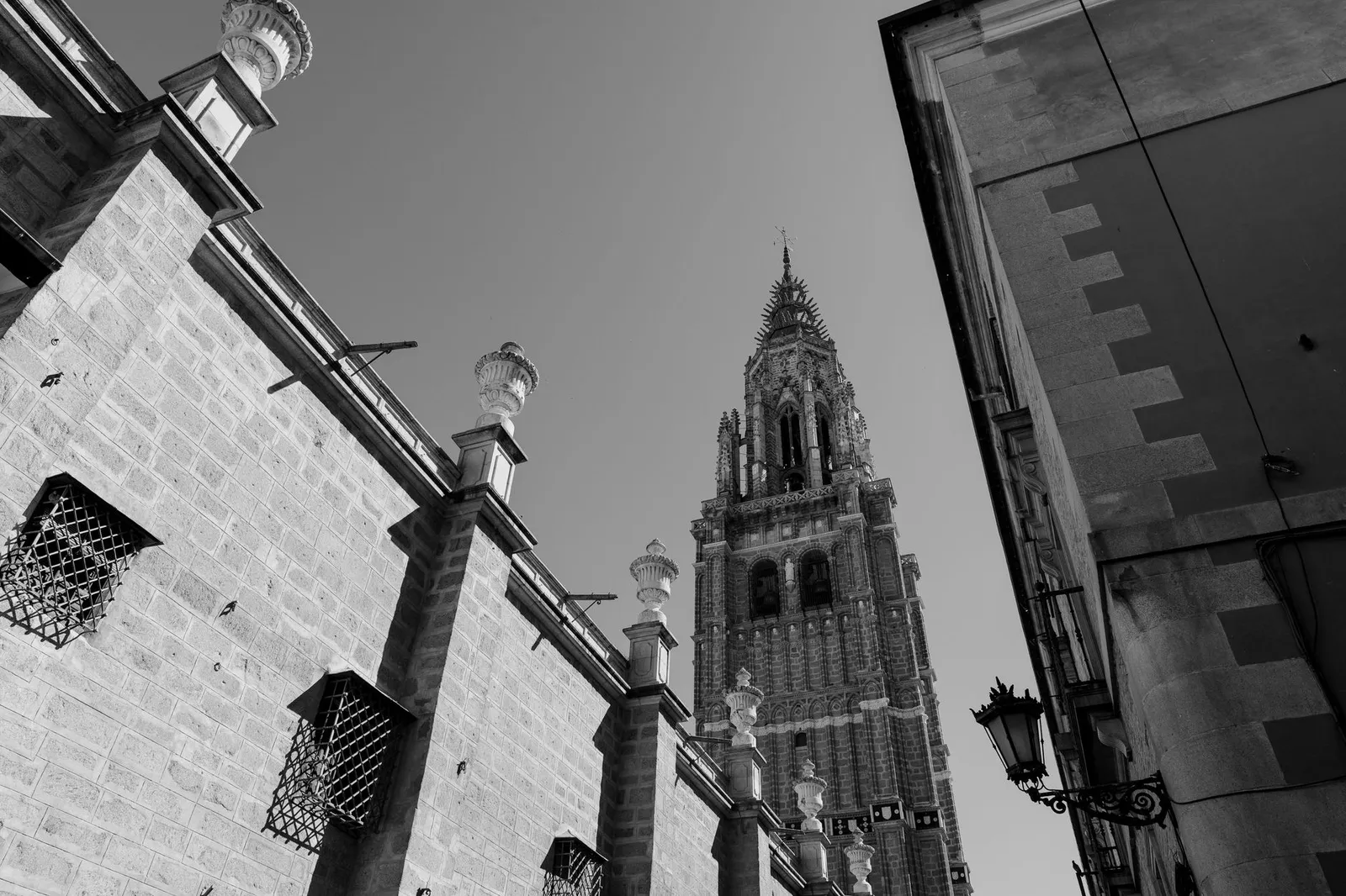 Black and white photograph showcasing the architectural beauty of Toledo Cathedral's tower.