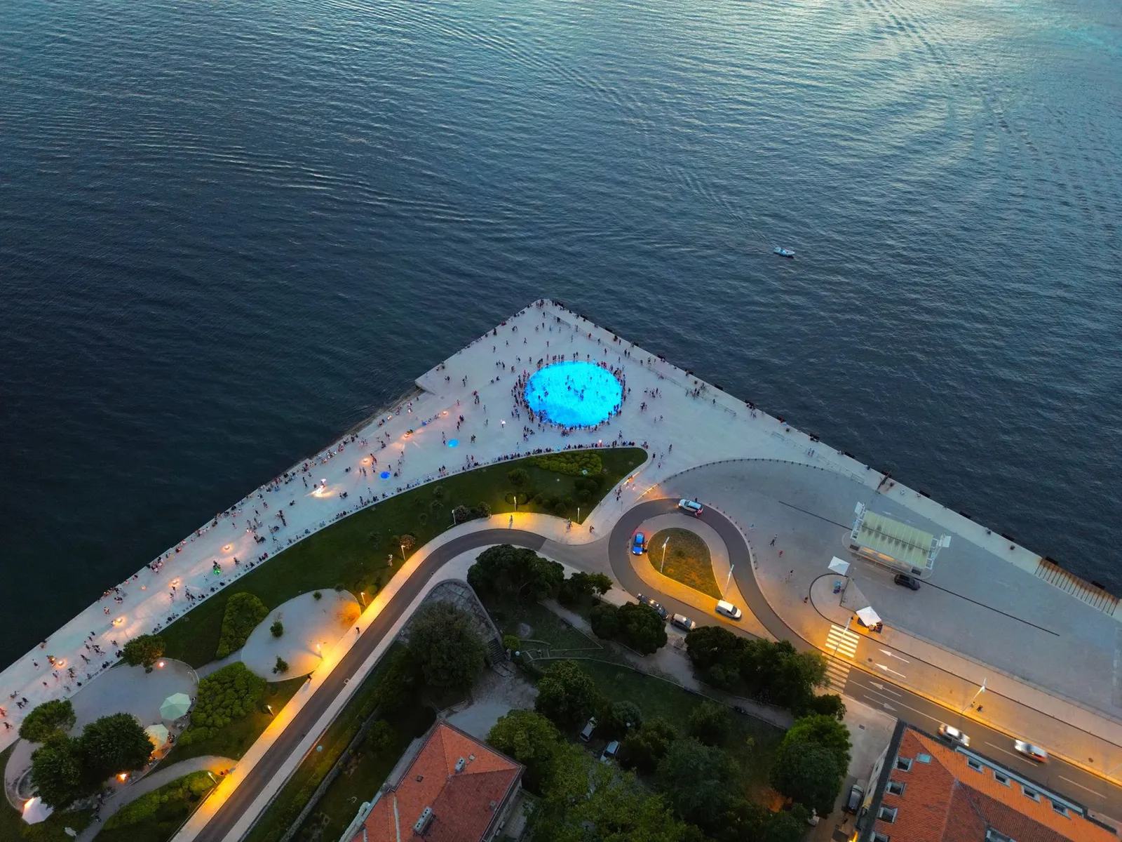 Stunning aerial view of Zadar's waterfront featuring the glowing Sea Organ at sunset.